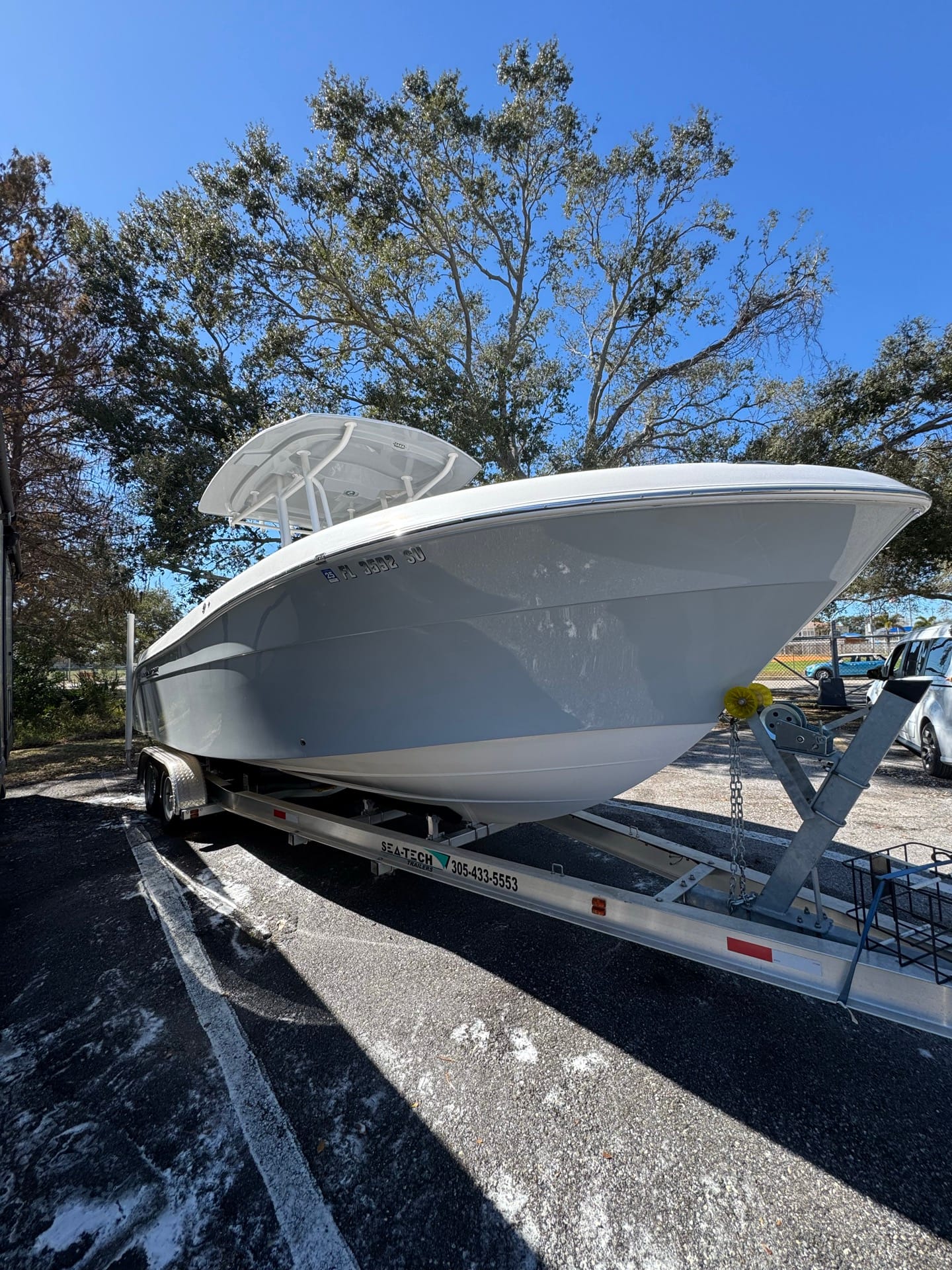 Ceramic-coated black RV panel in Tampa Bay with deep gloss after paint correction